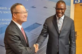 CS Owalo in a handshake