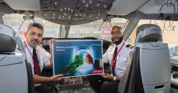 Two KQ pilots holding a certificate