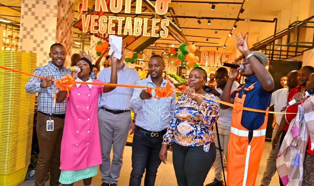 Naivas staff celebrating the launch